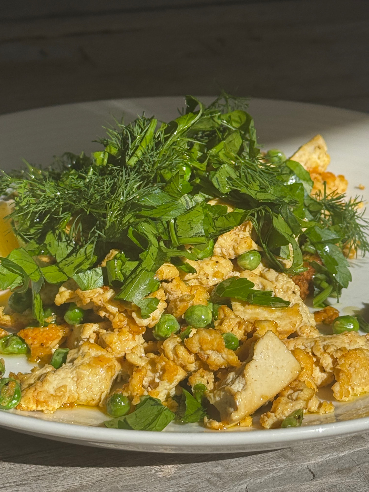 Scrambled eggs with peas and fresh herbs